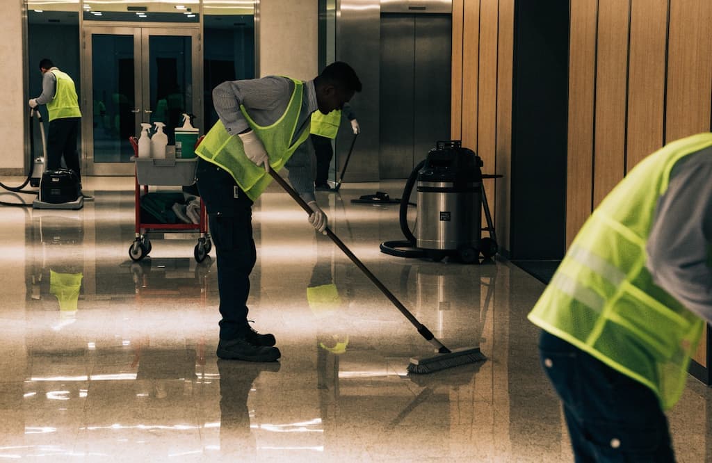 Home cleaning team preparing a living room for deep cleaning